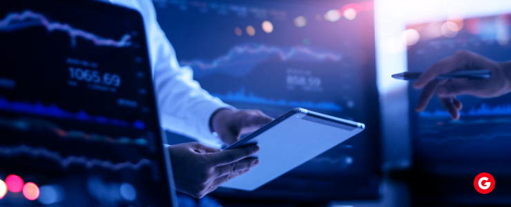 A man holds a tablet displaying various graphs, illustrating data analysis and insights.